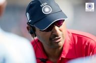 Coach Harendra Singh discussing strategy with the team